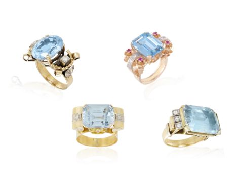 A GROUP OF FOUR RETRO RINGS CIRCA 1945, each set with a rectangular blue stone at the centre (possibly synthetic spinel) and 