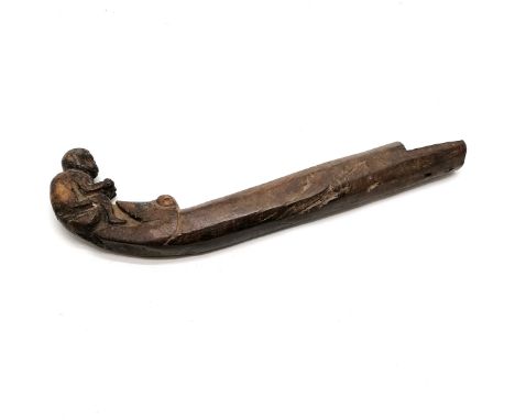 Antique African hand carved figural canoe decoration depicting a crocodile eating a monkey 45cm long.