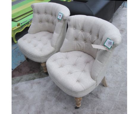 BEDROOM CHAIRS, a pair, upholstered in natural linen button backs on turned supports, 72cm H x 65cm W x 68cm D. (2)
