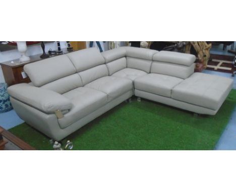 L SHAPED LEATHER SOFA, beige on metal supports.