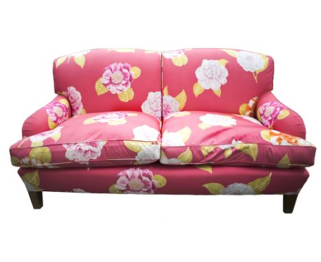 SOFA, in the Howard Style by Peter Dudgeon upholstered in a fuchsia fabric with pattern detail of differing rose breeds, 175c