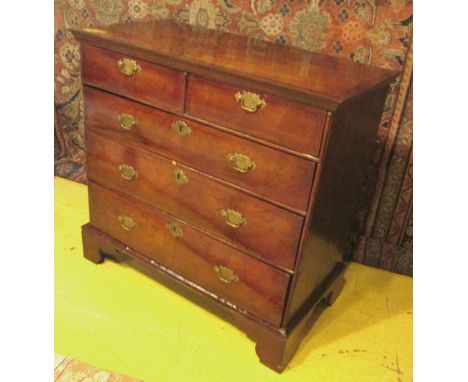 CHEST, Queen Anne figured walnut with a quarter veneered top and two short over three long drawers on bracket feet, 102cm W x