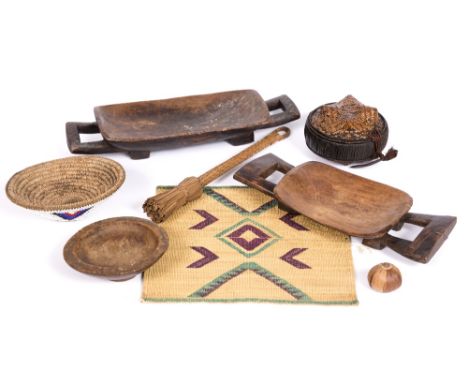 AN AFRICAN BASKETWARE CONTAINER AND COVER, possibly a millet cake basket; a Xhosa beadwork basket; a Zulu beer stirrer; a Tso
