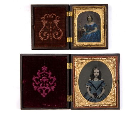 A VICTORIAN AMBROTYPE depicting a young girl holding a book, in Union Case, 10 x 8.5cm; and one further smaller in similar ca