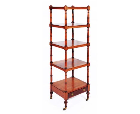 A GEORGE IV MAHOGANY FIVE TIER RECTANGULAR WHATNOT with ring turned supports, drawer and brass castors, 153cm high x 44cm wid