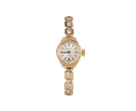 LADY'S MONTINE NINE CARAT GOLD MANUAL WIND WRIST WATCHthe round silvered dial with applied baton hour markers, 15mm case, on 