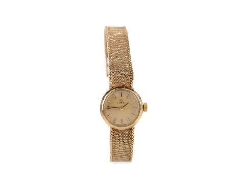 LADY'S OMEGA NINE CARAT GOLD MANUAL WIND WRIST WATCH,the round champagne dial with applied hour markers, 16mm case with perso