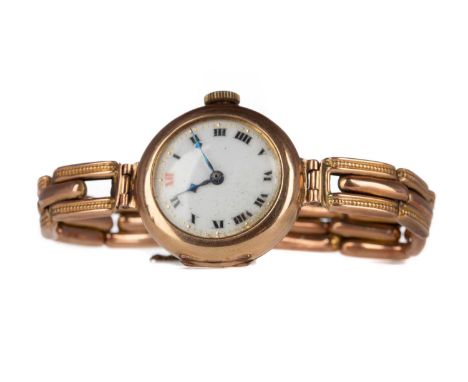 LADY'S NINE CARAT GOLD MANUAL WIND WRIST WATCH,the round white dial with Roman hour markers, dot outer seconds track, 25mm ca