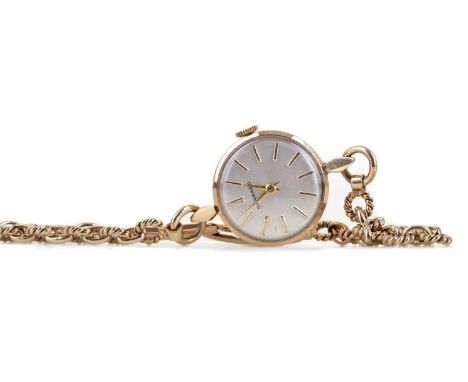 LADY'S GARRARD NINE CARAT GOLD MANUAL WIND WRIST WATCH ,the round white dial with applied baton hour markers, 19mm case, on a
