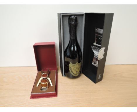 A bottle of Don Perignon Champagne Vintage 2000 750ml 12.5% vol in display box along with a Crug Champagne Opener Gift Set al
