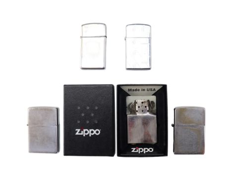 A group of Zippo and other flip-top petrol cigarette lighters