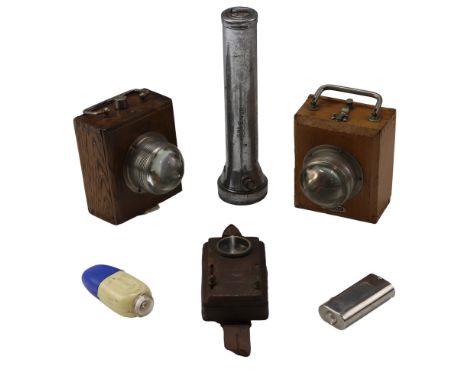 A collection of antique and vintage electric torches including an Ever Ready and one other wooden-cased "bull's eye" torch, a