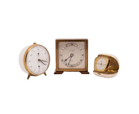An Elliott mahogany cased desk or mantel clock together with a Dolana alarm clock and a Schatz travel clock, circa 1960s
