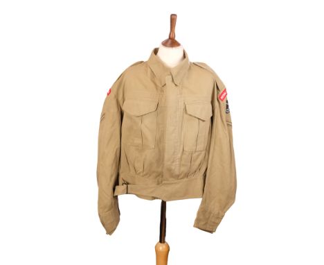 A 1943 British / Indian Army khaki drill Battledress blouse, bearing later insignia