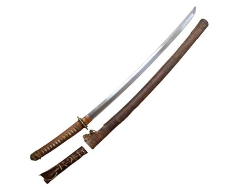 An Imperial Japanese Army officer's shin gunto sword, its blade exhibiting a clear hamon and having an inscribed tang with si