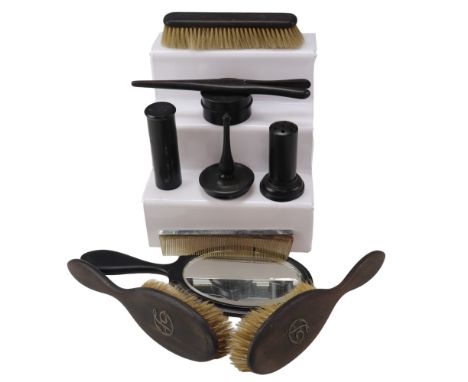 An early 20th Century ebony dressing table set including a ring stand and a mirror, latter 28 cm