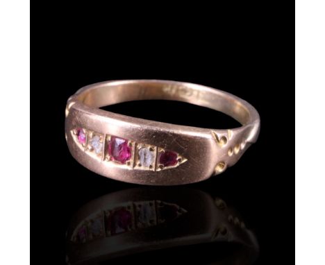 A Victorian red-and-white stone dress ring comprising five graded round-cut stones, gypsy-set between the decorative shoulder