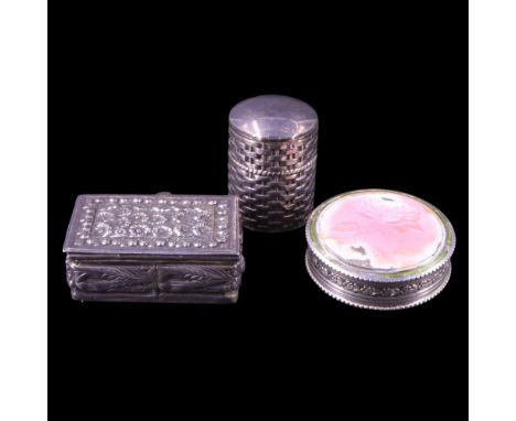 A continental European basse taille enamelled white metal pocket box, of drum form, its slip lid decorated in depiction of a 