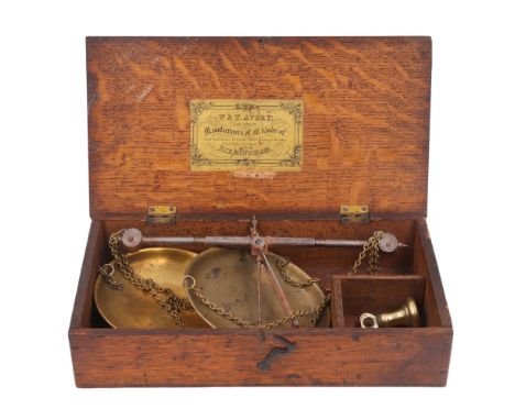 A Victorian oak-cased set of iron beam scales with brass pans by W &amp; T Avery, late T Beach, 28 cm x 15 cm x 7 cm
