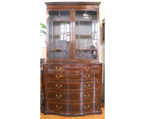 A fine George III inlaid mahogany bookcase secretaire chest, the upper stage having a dentil cornice, guilloche marquetry inl