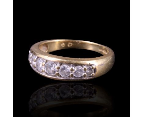 A seven-stone diamond dress ring comprising seven graded round-cut stones of approx 0.3 cts aggregate weight, channel-and-gra