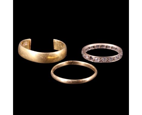 Two 22 ct gold wedding bands, (one a/f, 7.1 g aggregate weight), together with a white-stone and 9ct gold eternity ring, (1.7