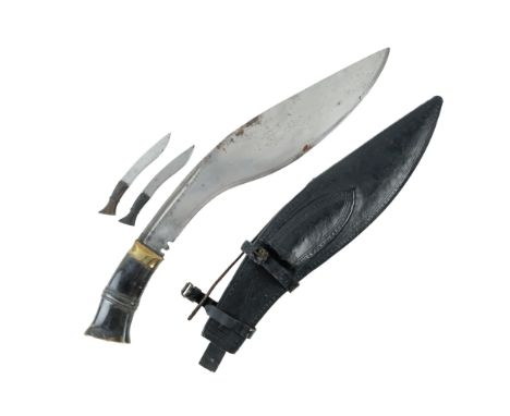 A fine antique Indian / Nepalese kukri, having a horn grip, its leather-covered wooden scabbard opening at one side, the blad