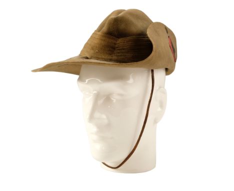 A 1942 dated British Army bush hat bearing a 1/6th East Surrey Regiment formation sign