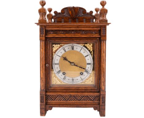 A late 19th / early 20th Century oak cased mantle clock by Winterhalder &amp; Hofmeier having a two-train movement and striki