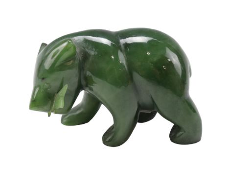 A jade or nephrite bear and fish, 5 cm high