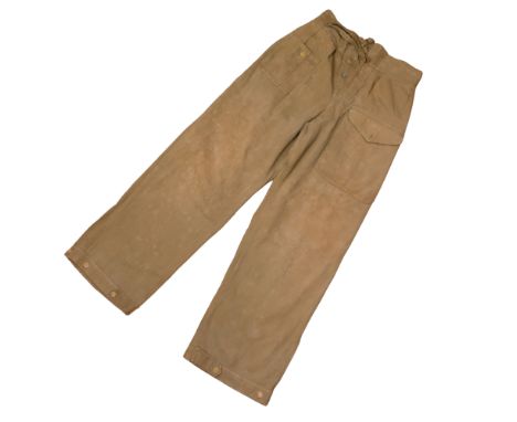A pair of Second World War 1943 dated British Army tropical jungle green battledress trousers