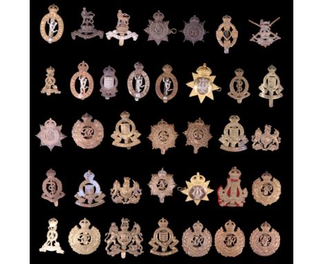 A collection of British Army Corps and other cap badges etc