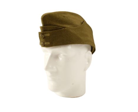 A 1943 Ordnance issue officer's Field Service cap, having green composition buttons