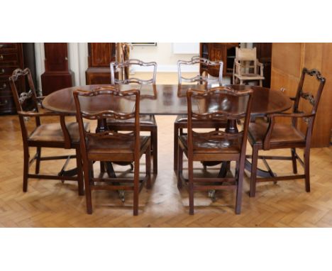 A set of six quality older reproduction George III mahogany dining chairs having hide upholstered drop-in seats, together wit