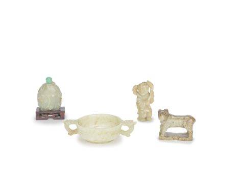 A GROUP OF FOUR VARIOUS JADE CARVINGSMing Dynasty and 19th centuryComprising: a pale green jade cup with twin horned dragon l