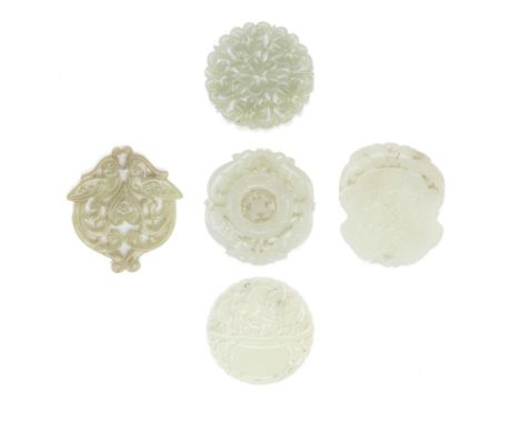 FIVE CIRCULAR JADE PLAQUES19th/20th CenturyComprising: a circular carving with a freely moving centre with four beasts carved
