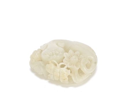 A PALE GREEN JADE 'CAT AND BUTTERFLY' CARVING18th/19th centuryThe recumbent feline with its young to one side, grasping a flo
