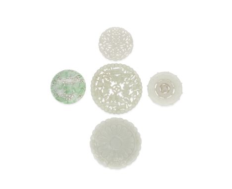A GROUP OF FIVE JADE PLAQUES19th/20th centuryComprising: a white jade circular pendant with freely moving wheel to the centre