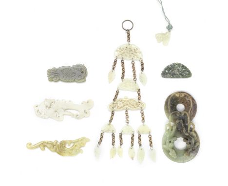 A COLLECTION OF JADE PLAQUES AND CARVINGSComprising: a carving of two conjoined bi discs with a pair of chi dragons clamberin