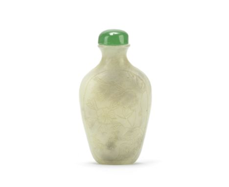 A PALE CELADON JADE SNUFF BOTTLE19th centuryIncised on one side to depict two fish frolicking beneath an overhanging tree, th