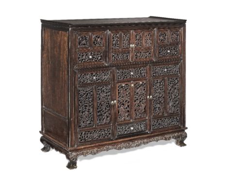 A MIXED HARDWOOD RETICULATED CABINETMid-Qing Dynasty and later Of rectangular shape rising from small cabriole legs below a s