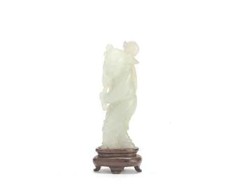 A VERY PALE GREEN JADE FIGURE OF A BOY18th/19th centuryDeftly carved as boy standing with his left foot forward, clad in long