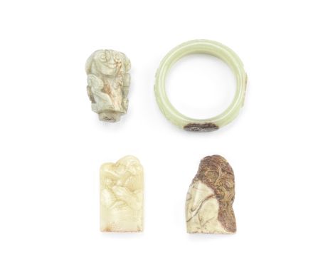 A JADE BANGLE, A JADE 'LINGZHI' FINIAL AND TWO SOAPSTONE SEALS19th/20th centuryThe bangle incised with buffalo and two dragon