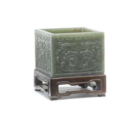 A SPINACH JADE SQUARE WASHERWanli four-character mark, 19th/early 20th centuryEach face carved in low relief with a taotie ma