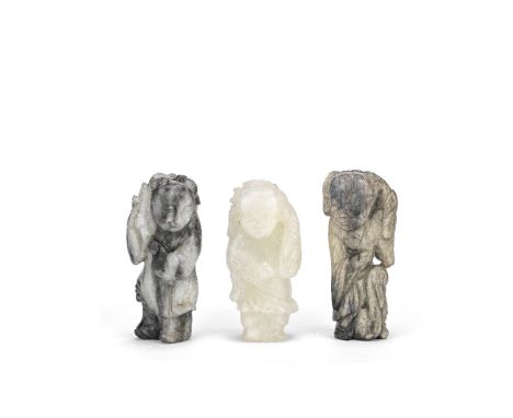 THREE JADE 'BOYS' CARVINGS17th/18th CenturyComprising: a mottled creamy grey jade carving of a boy standing in flowing robes 