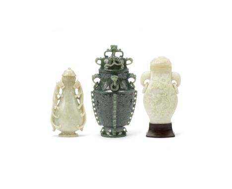 THREE HARDSTONE VASES AND COVERS20th CenturyComprising: a hu vase and cover, set with elephant head handles, incised on one s