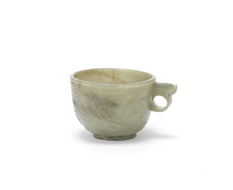 A CELADON JADE CUPEarly 20th centuryWith deeply rounded sides raised on a short foot, the body incised with two chi dragons, 