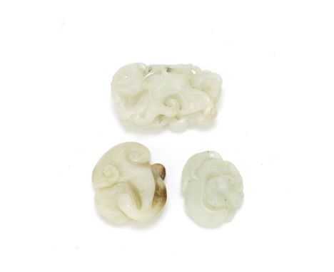 THREE JADE 'FUNGUS' CARVINGS19th centuryComprising: a water caltrop carving formed as a leafy stem bearing differently sized 