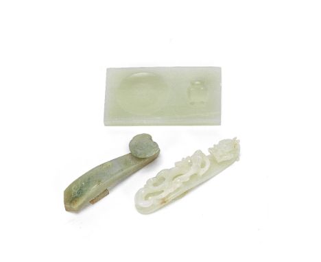 TWO JADE BELT HOOKS AND A JADE INKSTONE18th century or laterComprising: a white jade chi dragon belt hook; a belt hook in the