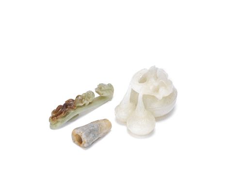 A GROUP OF THREE VARIOUS JADE CARVINGS20th centuryComprising: a white jade 'lotus buds and frog' group; a pale green and russ